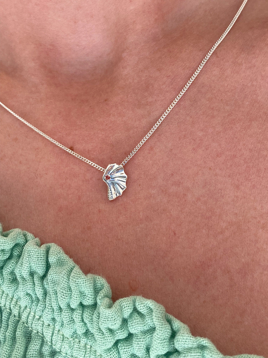 Deep sea shell sapphire pendant